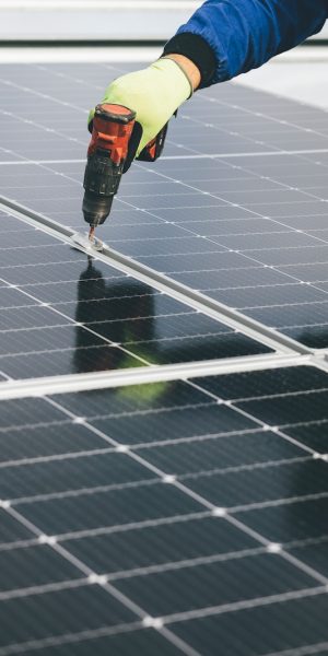a person working on a solar panel